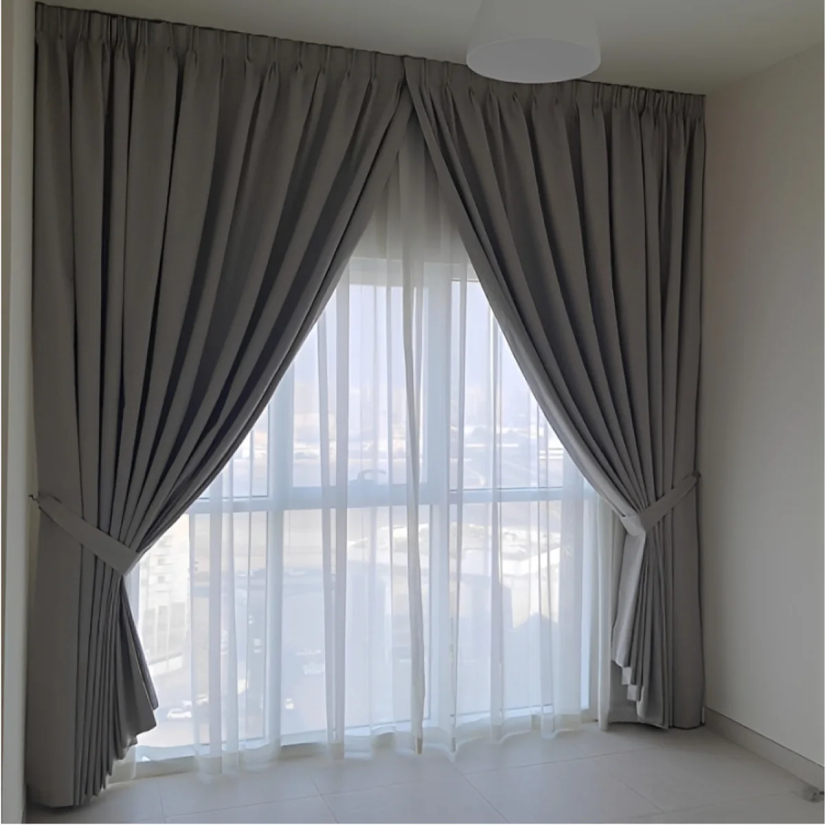 Layered curtains in a sunlit room